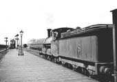 Ex-LNWR 'Cauliflower' 0-6-0 No 8459 has been given the right of way by the starter at Leamington Avenue's down platform