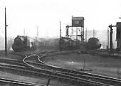 Close up showing the shed's new mechanised ash disposal plant  with the old LNWR coaling shed on the right