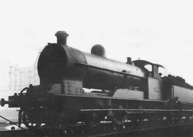 An unidentified ex-LNWR 4-6-0 19 inch Express Goods class locomotive is seen standing on Nuneaton shed's manually operated 50 foot turntable