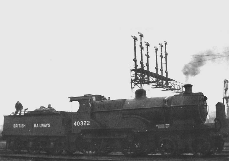 Ex-S&DJR 4-4-0 2P No 40322 is seen being tidied up by its fireman having just been under Nuneaton's mechanical coaling plant