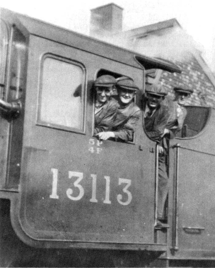 View of Charles Woodford and an enthusiastic team of fitters pose in the cab of LMS 2-6-0 5F/4P No 13113 later renumbered No 2813