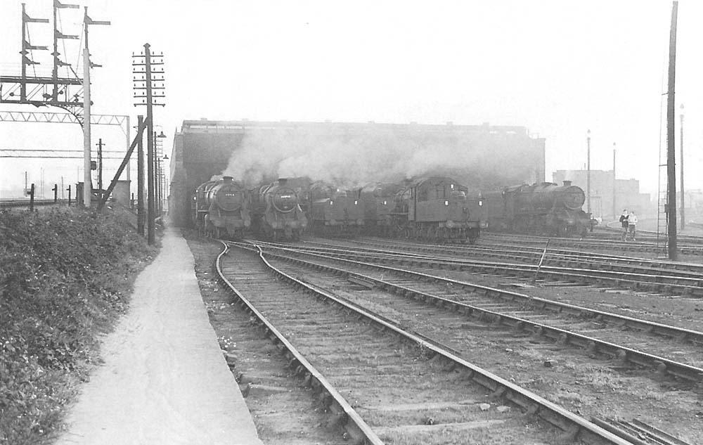 View of Nuneaton's rebuilt shed with a full compliment of locomotives being prepared for work on 7th October 1962