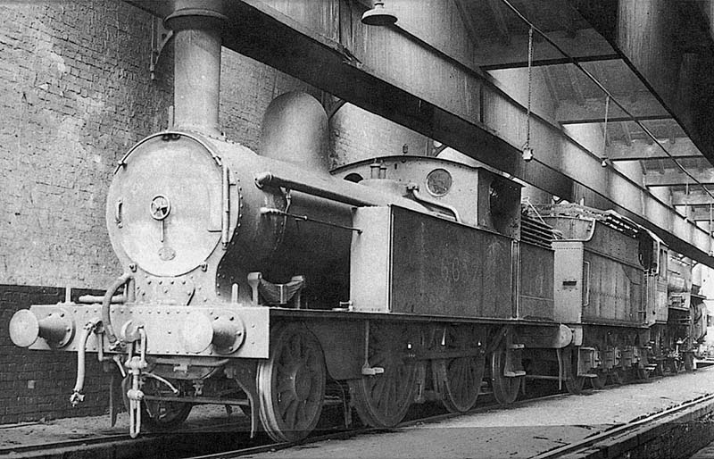 Ex-LNWR 1P 2-4-2T No 6657 is seen standing cold inside Nuneaton shed on Saturday 10th April 1937