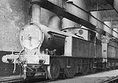Ex-LNWR 1P 2-4-2T No 6657 is seen standing cold inside Nuneaton shed on Saturday 10th April 1937