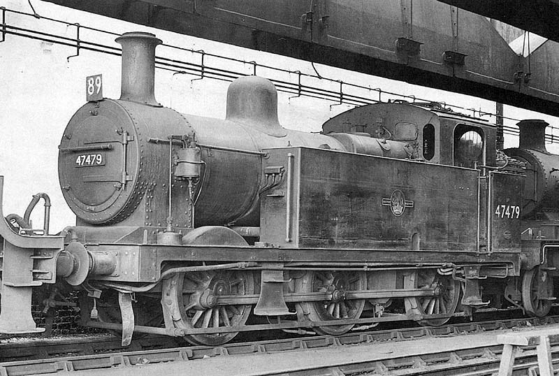 Ex-LMS 3F 0-6-0 No 47479 stands with other locomotives inside Nuneaton shed during September 1962