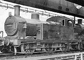 Ex-LMS 3F 0-6-0 No 47479 stands with other locomotives inside Nuneaton shed during September 1962