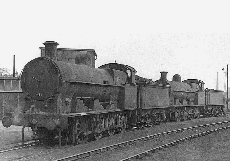 Ex-LNWR 7F Class G2a 0-8-0 No 49377 and ex-LNWR 7F Class G2a 0-8-0 No 49441 stand buffered up on one of Nuneaton shed's sidings