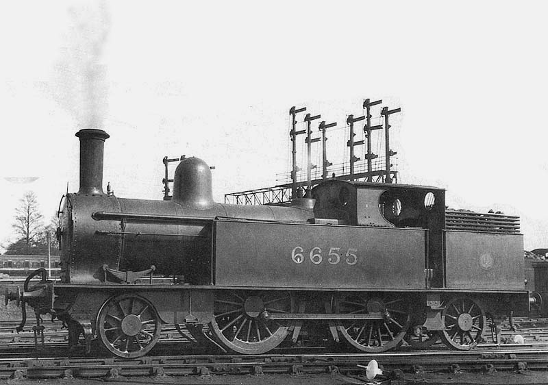 Ex-LNWR 1P 2-4-2T No 6655 is seen raising steam at Nuneaton shed in March 1933