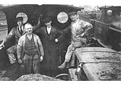 A small group of engine fitters pose for the camera in the cab of an ex-LNWR 0-6-0 locomotive at Nuneaton shed in the 1920s