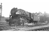 USATC S160 2-8-0 Class No 2153 poses with JM Dunn, shedmaster, outside Nuneaton shed circa 1944