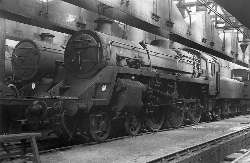 View inside Nuneaton shed showing British Railways Standard class 4MT No 75063 and ex-LMS 8F 2-8-0 No 48686 standing at rest