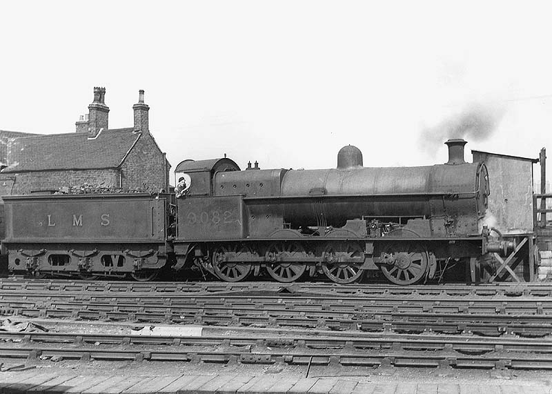 Ex-LNWR 0-8-0 Class G2a No 9082 is seen at the head of an up goods train in front of Nuneaton's hump at the throat of the marshalling yard