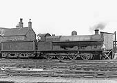 Ex-LNWR 0-8-0 Class G2a No 9082 is seen at the head of an up goods train in front of Nuneaton's hump siding