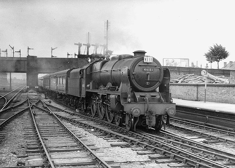 Ex-LMS 4-6-0 Rebuilt Royal Scot class No 46151 'The Royal Horse Guardsman' is seen at the head of a down express approaching platform two