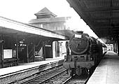Ex-LMS 4-6-0 Rebuilt Royal Scot class No 46127 'Old Contemptibles' is seen at the head of a down express passing through Nuneaton station's platform three