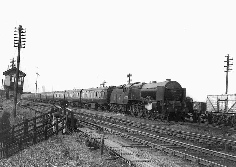 LMS 4-6-0 Royal Scot class No 6105 'Cameron Highlander' is seen approaching Nuneaton station at the head of an up express service