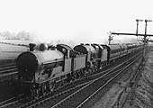 An unidentified 4-6-0 ex-LNWR Prince of Wales class is seen piloting an unidentified 4-6-0 member of the Royal Scot class still attached to Fowler tender