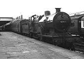 Ex-Midland Railways 2P No 40447, a 483 class locomotive, is seen standing at platform two with a local stopping train