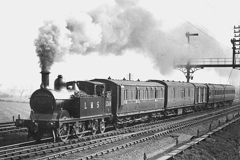 Ex-MR 1P No 1369, a class 2228 locomotive, is seen at the head of a branch line train to Ashby as it is about to cross over to join the branch