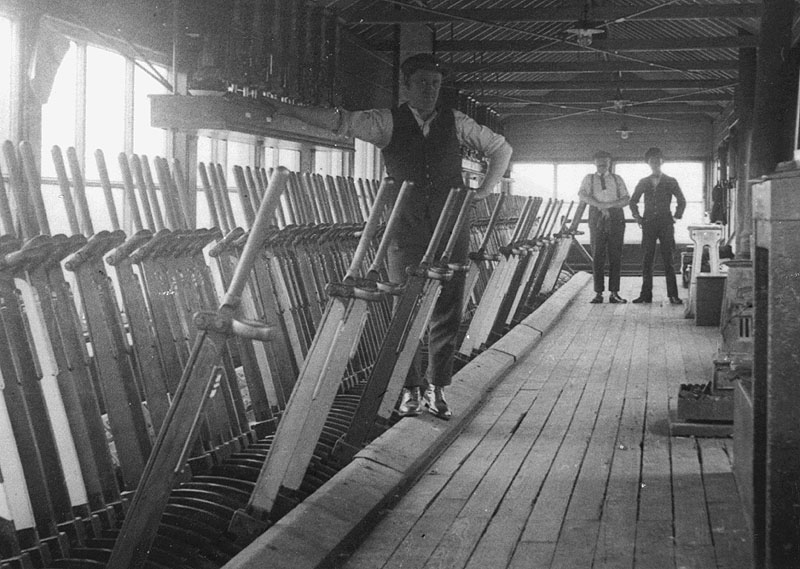 An internal view of Nuneaton No 7 Signal Box showing some of the 'bobbies' in charge of the 180 lever frame