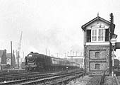 Ex-LMS 4-6-0 rebuilt Jubilee class No 45735 'Comet' is seen at the head of an up express as it passes Nuneaton No 1 Signal Box