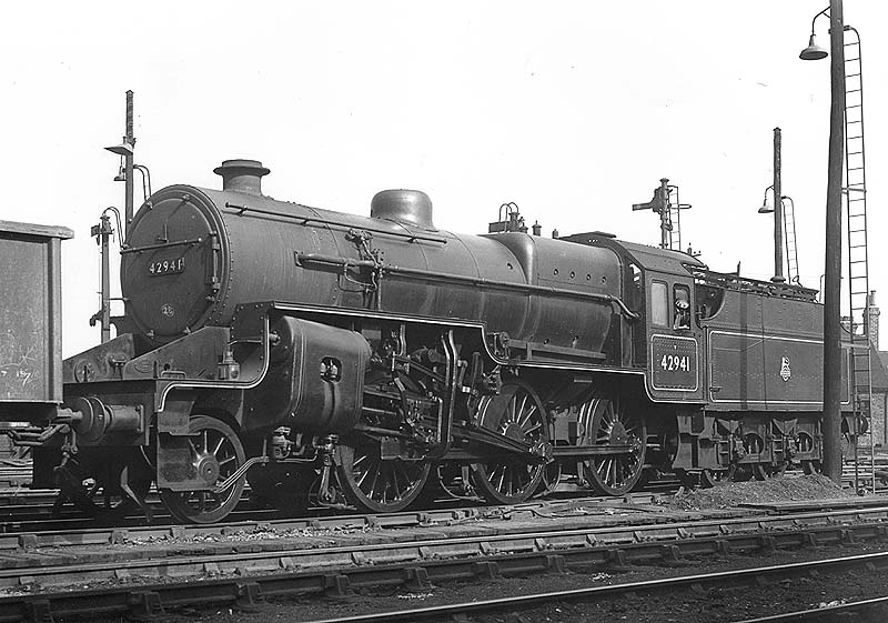 Ex-LMS 2-6-0 'Hughes Crab' No 42941 is seen resplendent in British Railways full mixed traffic lined out livery as it shunts in the up marshalling yard