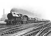 Ex-LNWR 4-6-0 Claughton class No 5999 'Vindictive' is seen approaching Nuneaton at speed at the head of a down express