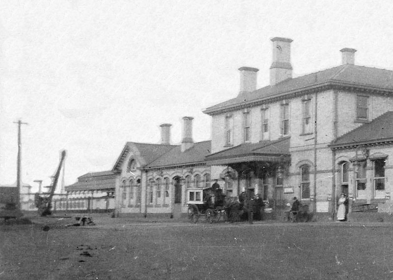 Close up showing the new canopy fitted to Nuneaton station with a LNWR horse drawn passenger vehicle in attendance