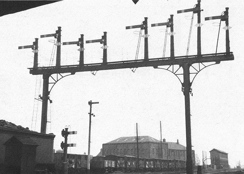 Looking towards Rugby station from under Leicester Road bridge showing the signals that controlled access to Nuneaton station
