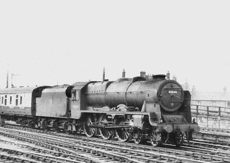 Ex-LMS 4-6-0 rebuilt Patriot class No 45540 'Sir Robert Turnball' is seen at the head an up express service exiting platform 5