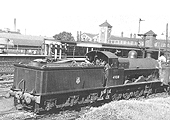 Ex-LNWR 0-8-0 class G2a No 49318 is seen shunting stock over the hump in Nuneaton's up marshalling yard