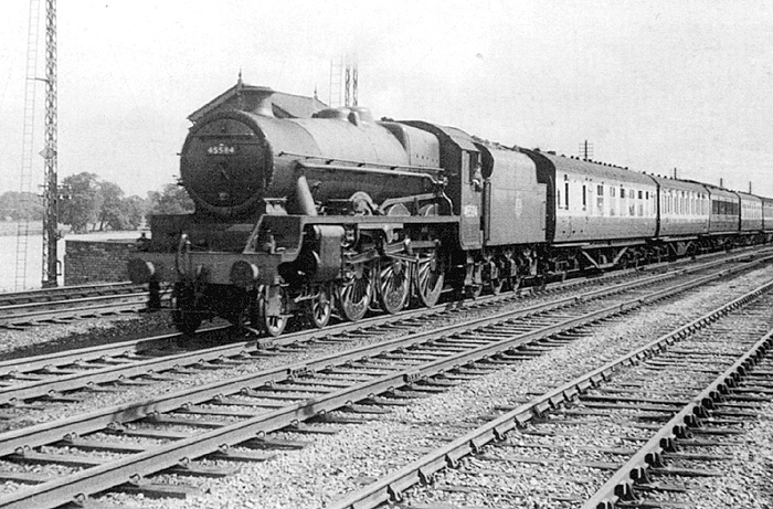 Ex-LMS 4-6-0 5XP Jubilee class No 45584 'North West Frontier'  is seen passing Ashby junction at the head of an express to Manchester