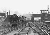 BR Standard Class 7MT 4-6-2 No 70016 'Ariel' passes through the station at the head of a special to Crewe