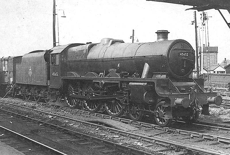 Ex-LMS 5XP 4-6-0 No 45652 'Hawke' stands in the up sidings being coupled up to a southbound freight train in 1963