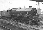 Ex-LMS 5XP 4-6-0 No 45652 'Hawke' stands in the up sidings being coupled up to a southbound freight train in 1963