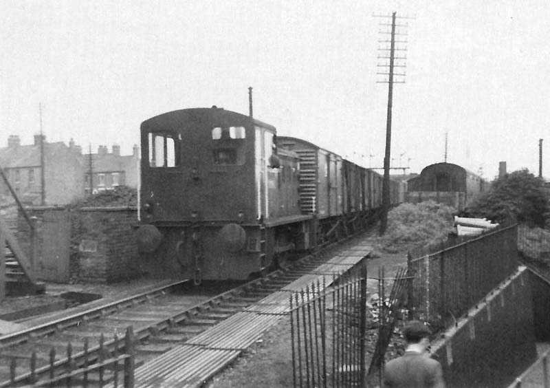 An unidentified 0-4-0 Diesel locomotive shunts in the sidings adjacent to Nuneaton No 1 Signal Cabin
