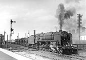 British Railways Standard Class 9F No 92156 is seen at the head of a mineral train leaving the up marshalling yard