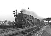 British Railways 4-6-0 Standard class 5MT No 73033 is seen passing under the Midland line to Leicester on a down Class C goods service