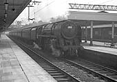 BR 7MT 4-6-2 No 70054 'Dornoch Firth' heads a down express through Nuneaton station on 26th March 1964