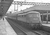 English Electric E3030 is at the head of the four coach down express train at Nuneaton station on 26th March 1964