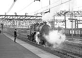 BR Class 4MT 2-6-0 No 76052 of Saltley shed in Birmingham is travelling through Nuneaton station 'wrong line'
