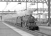 Ex-LMS 'Black 5' 4-6-0 No 45324 speeds into the station from the north, laying a smokescreen over the tracks