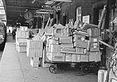 Parcel traffic on platform 1 being made ready for loading on to one or more services to the north of England on 13th August 1964