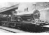 Teutonic 2-2-2-0 No 1306 'IONIC' with extended front frames stands at Nuneaton's second station, built circa 1875