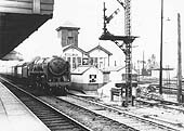 British Railways Standard Class 7MT 4-6-2 No 70012 'John of Gaunt' passes Nuneaton station's No 2 Signal Cabin in 1958