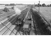 Ex-LMS 5MT 4-6-0 No 45238 heads a Class H through freight past Jees Quarry sidings on the Trent Valley line circa 1960