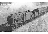 Close up showing LMS 8F 2-8-0 No 8111 dwarfing the unidentified ex-LNWR 2F 0-6-0 'Cauliflower Class' locomotive it is piloting