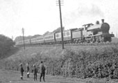 Close up showing the variety of rolling stock being coupled behind the two locomotives including NLR stock