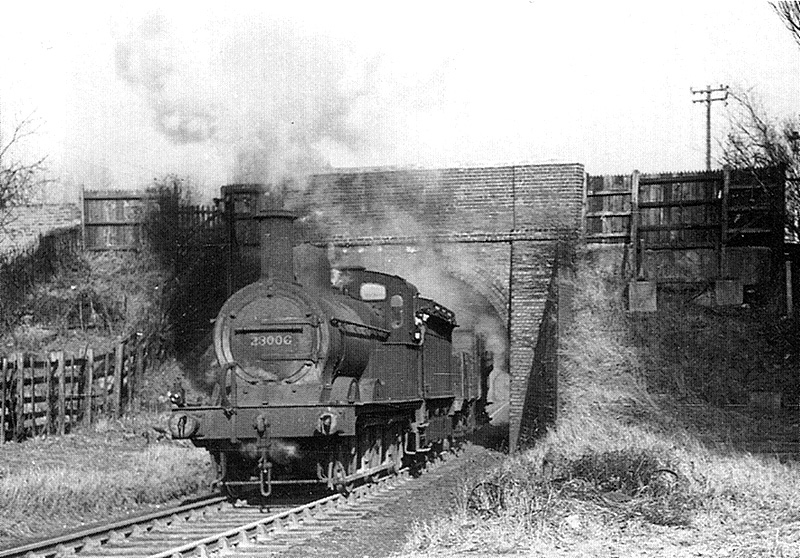 Ex-Midland Railway 0-6-0 2F No 23006 emerges from beneath Selwyn Road overbridge with a train for Mitchell & Butler's brewery
