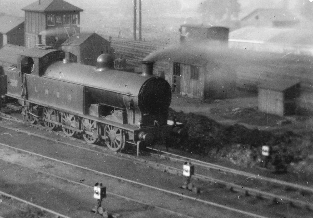 Close up showing LNWR 0-8-2T No 2348 which is seen shunting in the up exchange sidings of at Rugby